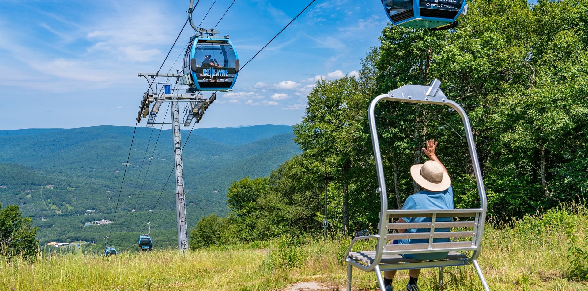 Guest waiving at gondola riders