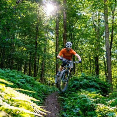 Mountain Biker catches some air in Giggle Hollow